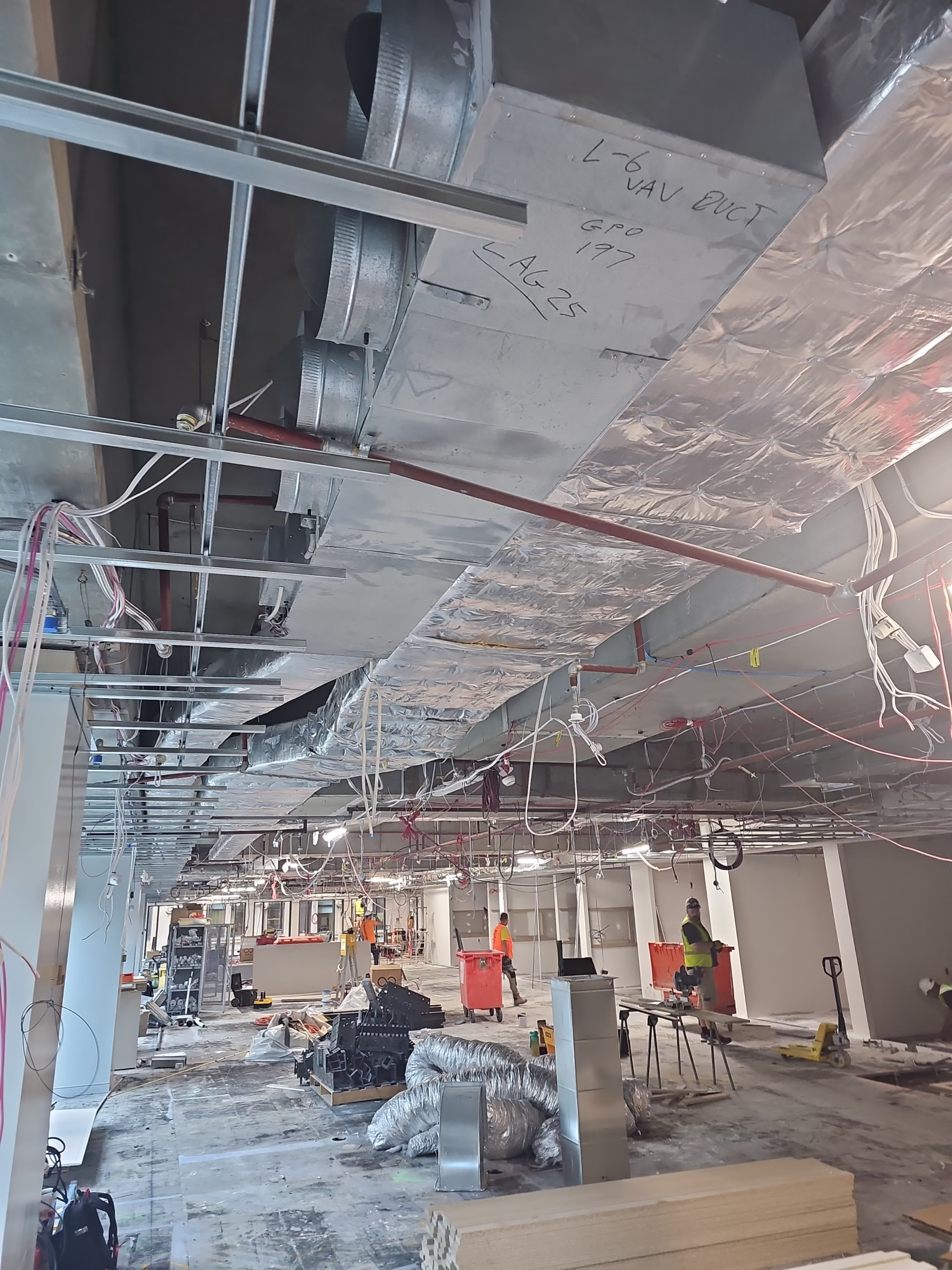 "Energy Recovery Ventilator (ERV) installation showing ductwork, connections, and mechanical components in ceiling space